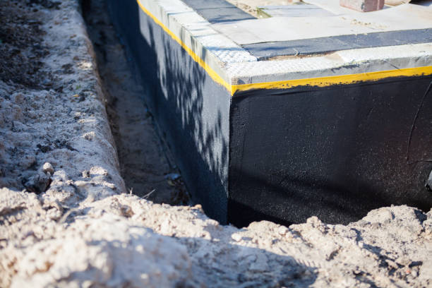 Professional Waterproofing technician working in Chester, PA